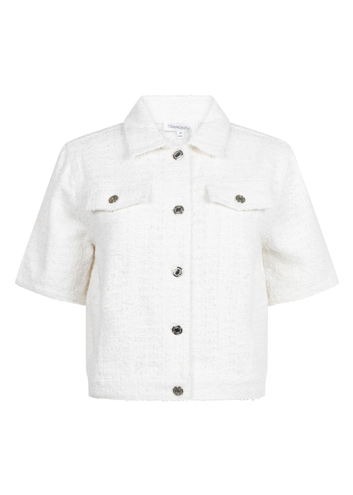 White denim jacket with button details on a white background