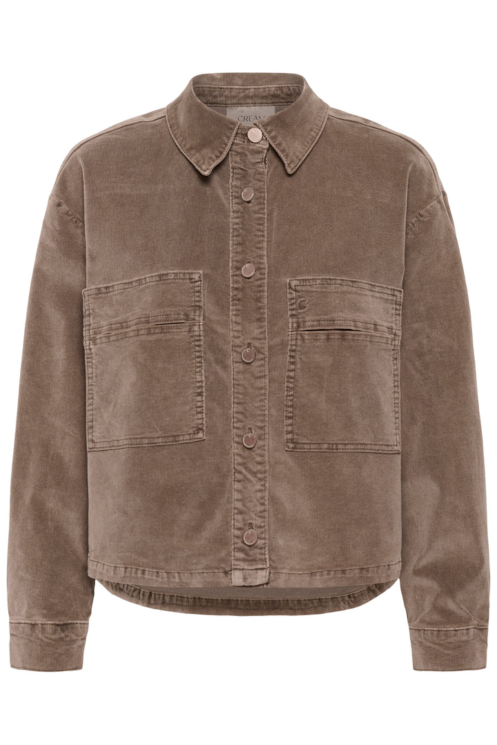 A cropped button-up shirt jacket in brown corduroy fabric, featuring a pointed collar, button front, and two large chest flap pockets, shown against a plain white background.