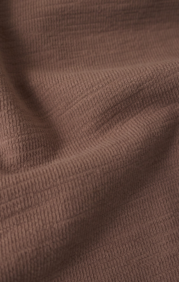 Close-up of brown textured fabric