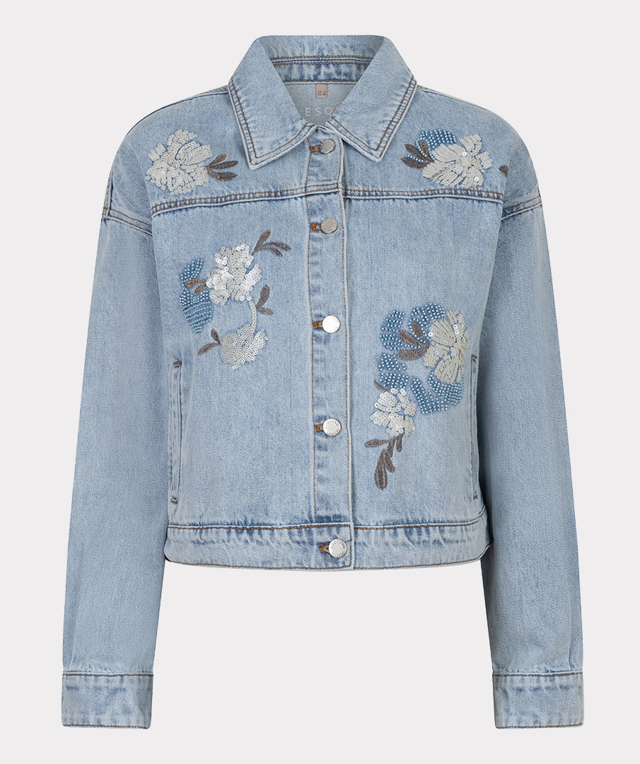 Light blue denim jacket with floral embroidery on a light gray background