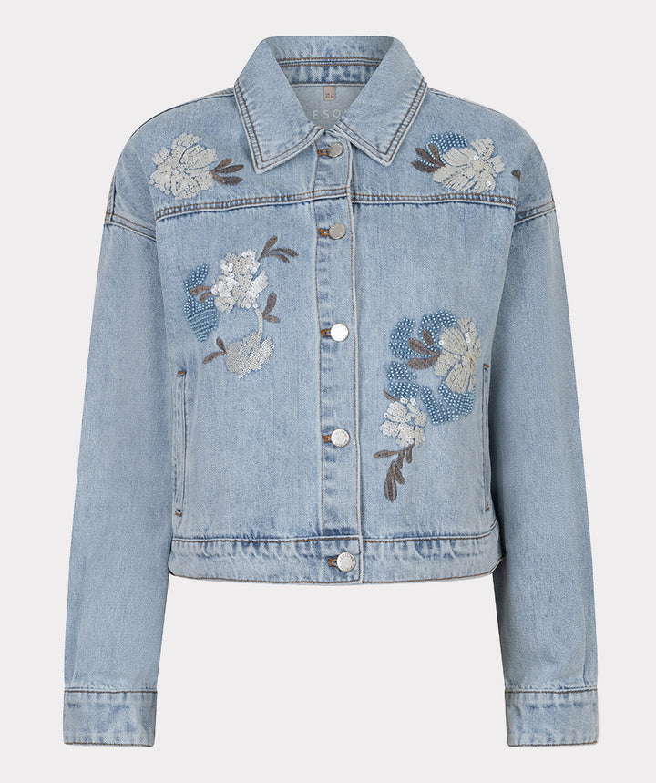 Light blue denim jacket with floral embroidery on a light gray background