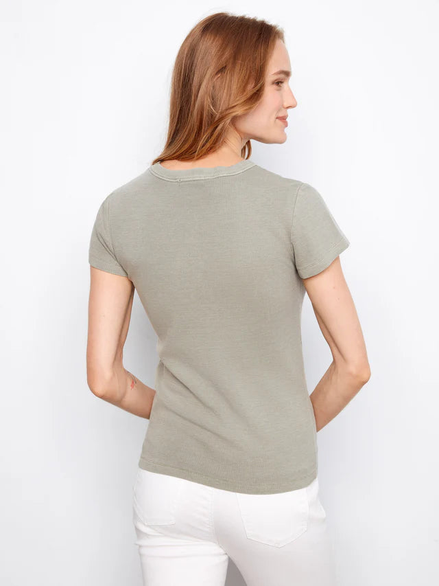 Woman wearing a green t-shirt against a white background