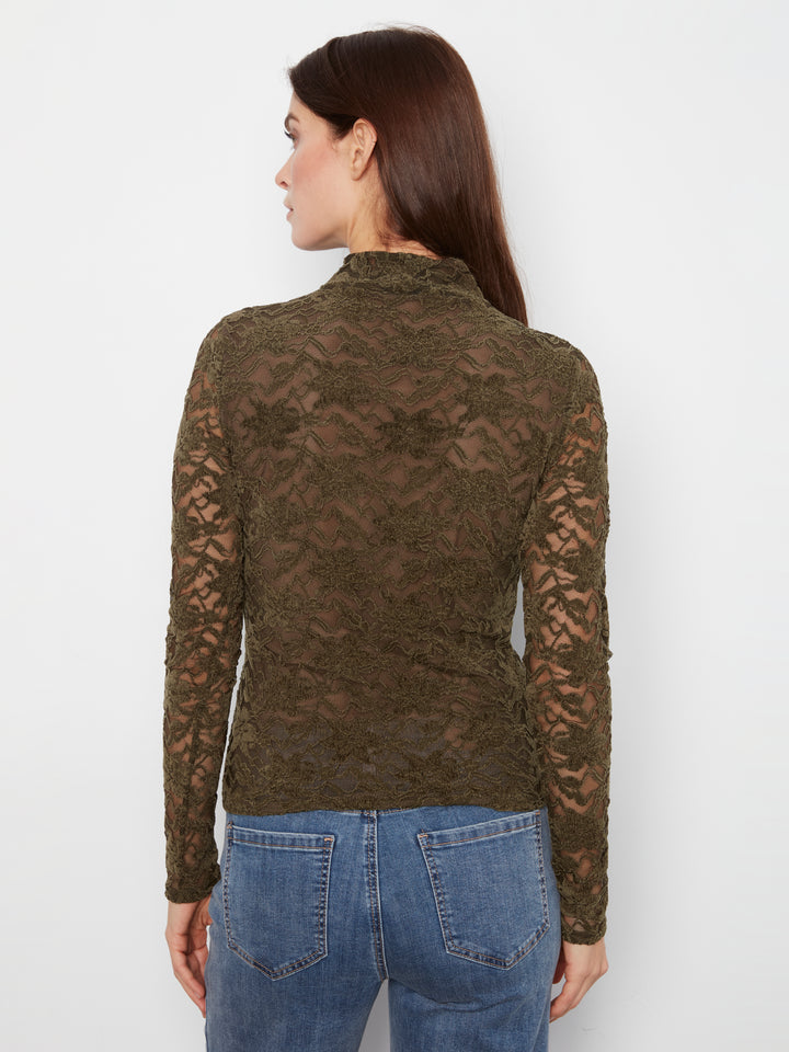 A woman viewed from the back wearing a dark olive brown lace long-sleeve mock neck top and blue jeans, against a plain white background.
