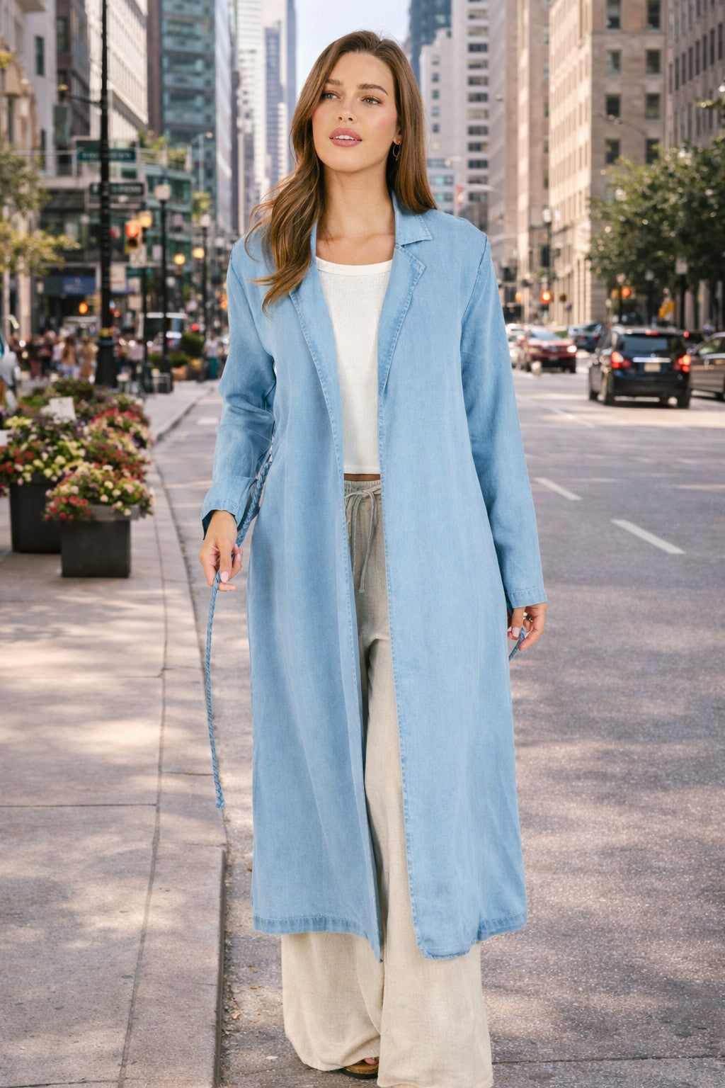 Woman in a blue coat walking on a city street