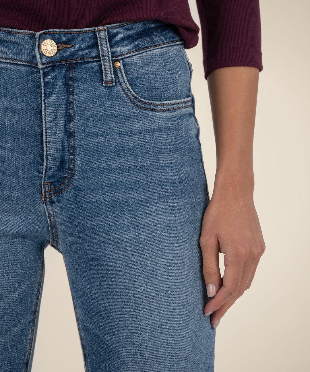 Close-up of blue jeans with a neutral background