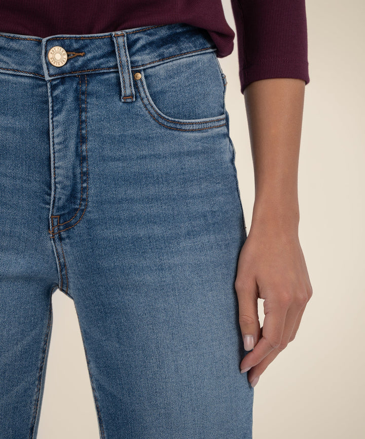 Close-up of blue jeans with a neutral background