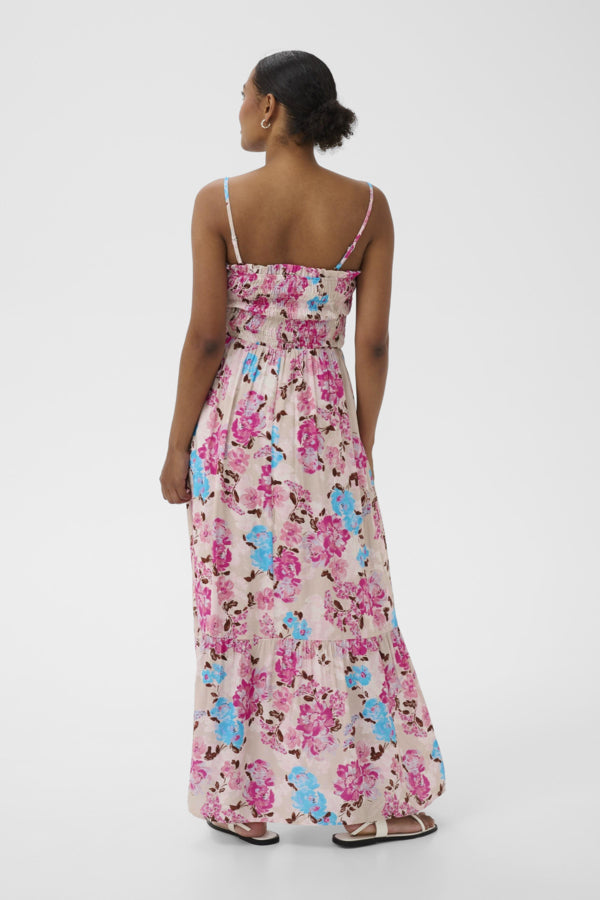 Woman wearing a floral dress on a white background