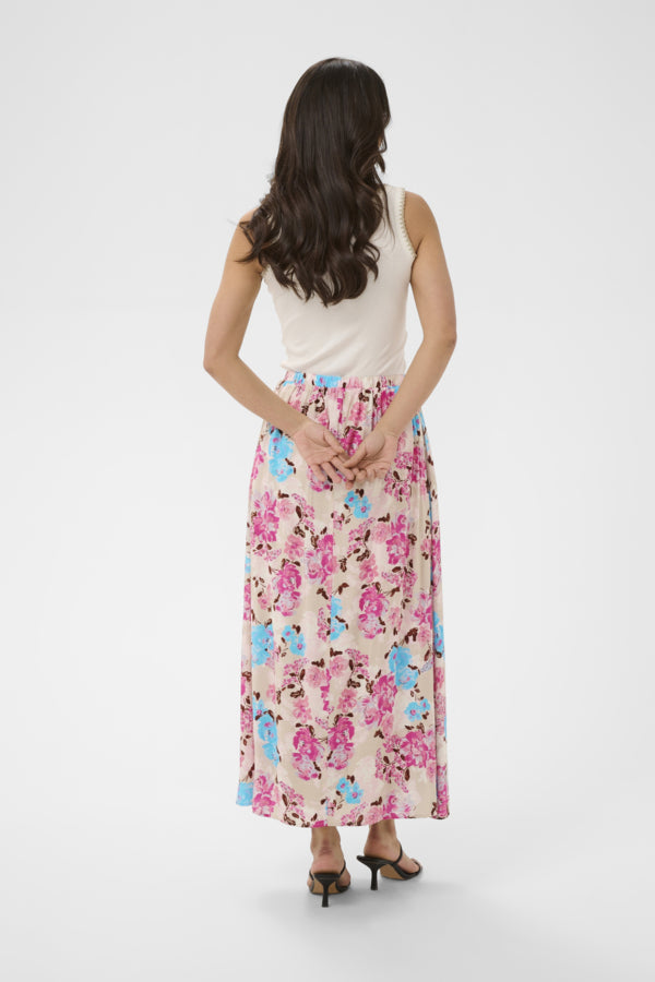 Woman wearing a floral skirt on a white background