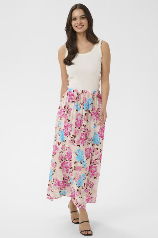 Woman wearing a floral dress with a white background