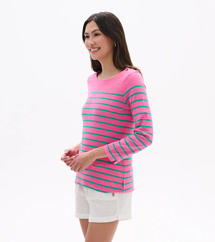 Woman wearing a pink and blue striped sweater on a white background