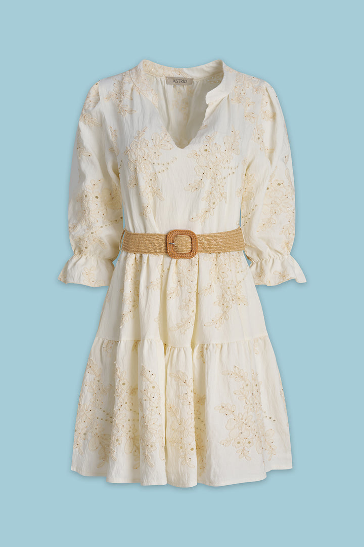 White dress with a brown belt on a light blue background