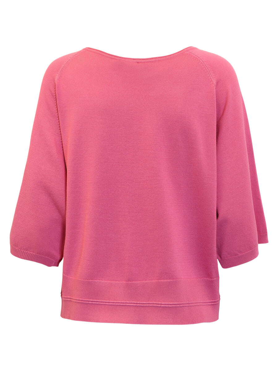Pink sweater on a white background