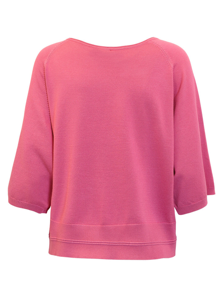 Pink sweater on a white background