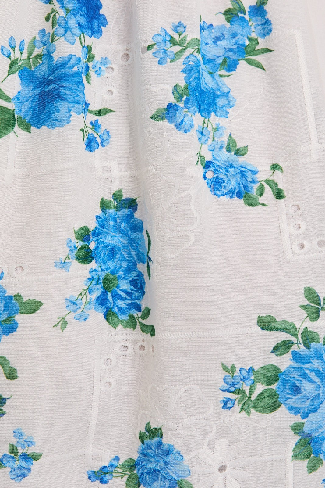 White fabric with blue floral pattern