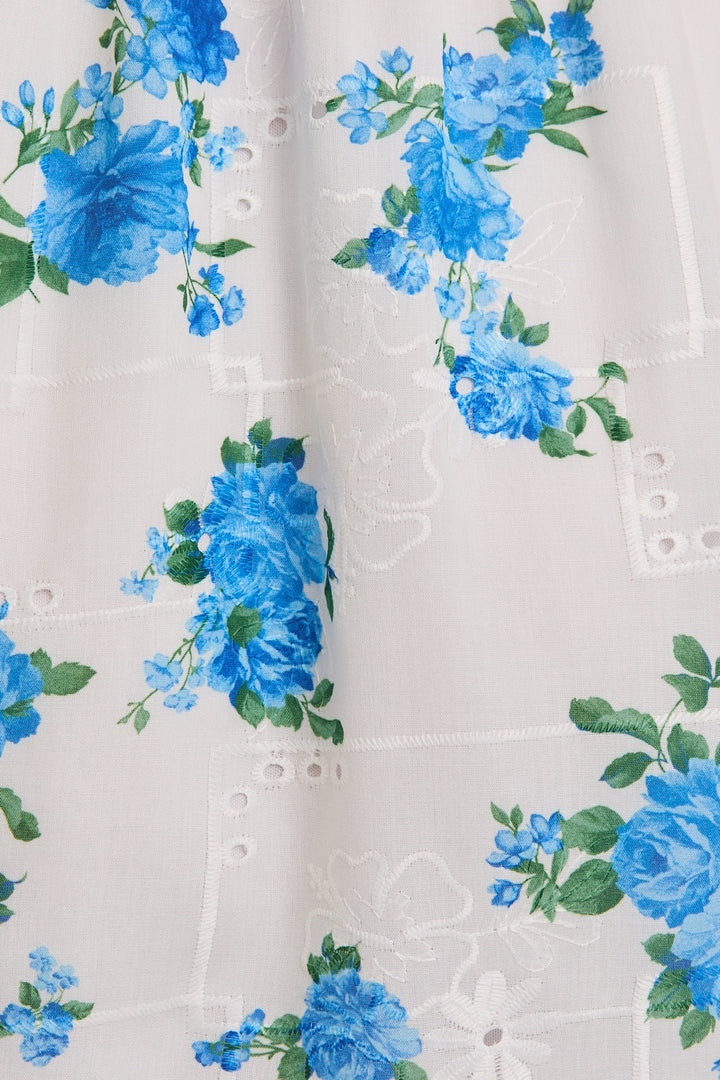 White fabric with blue floral pattern