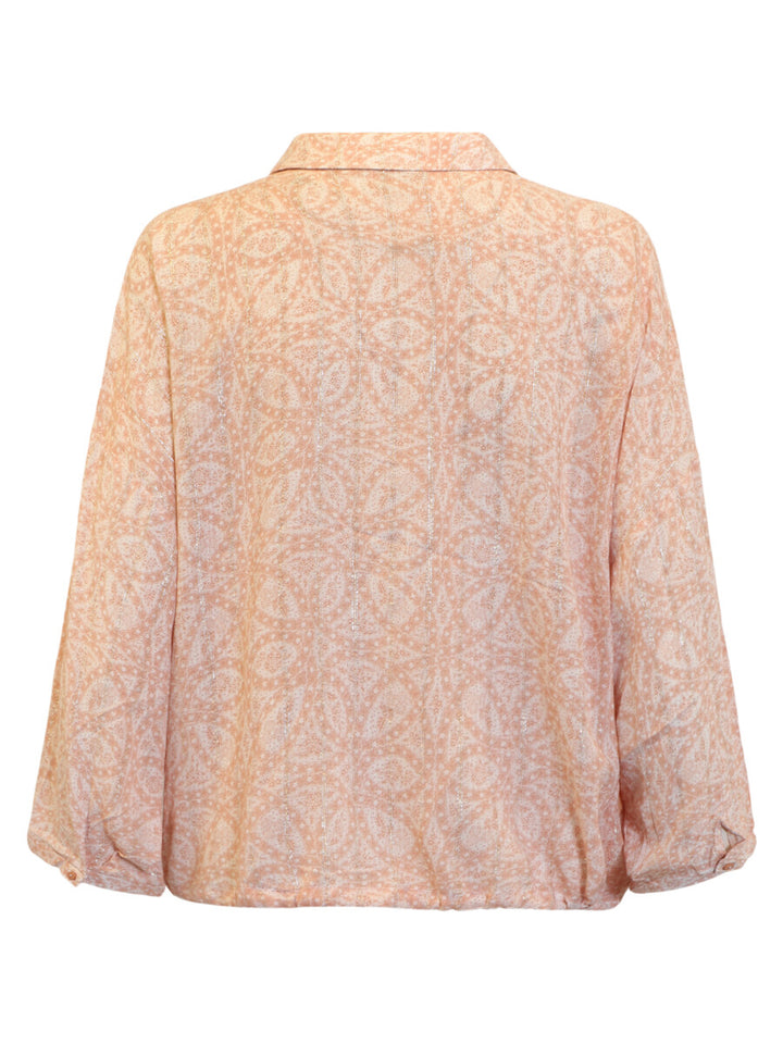 Light pink floral patterned blouse on a white background