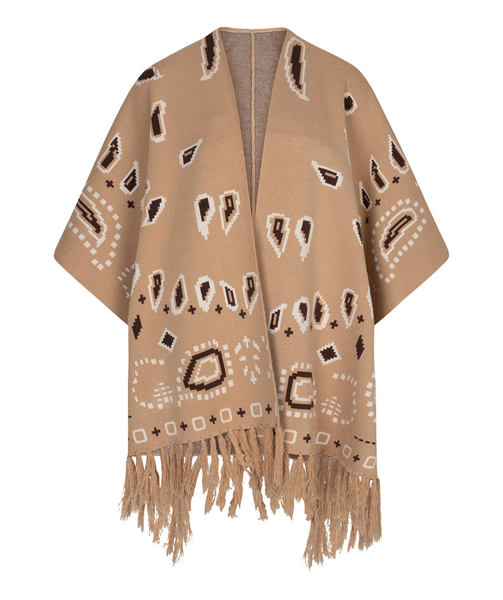 A beige open-front wrap or poncho with fringe at the bottom and an allover geometric pattern in white and dark brown, shown on a plain white background.