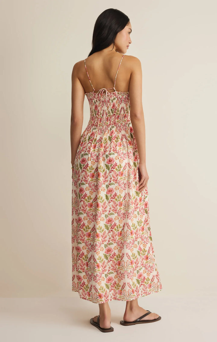 Woman wearing a floral dress on a beige background