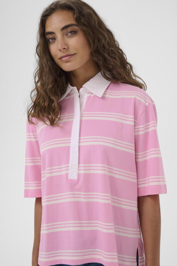 Woman wearing a pink and white striped shirt on a plain background