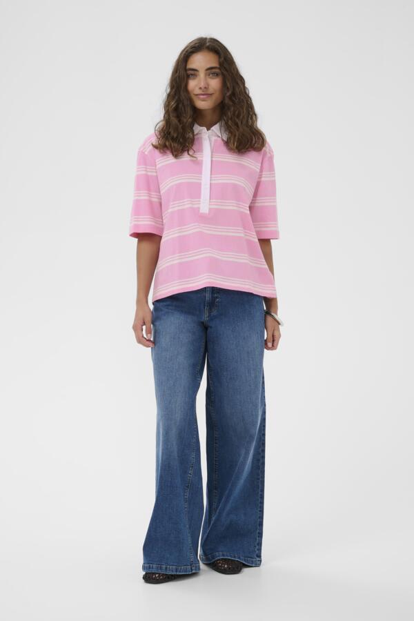 Woman wearing a pink striped shirt and blue jeans on a white background