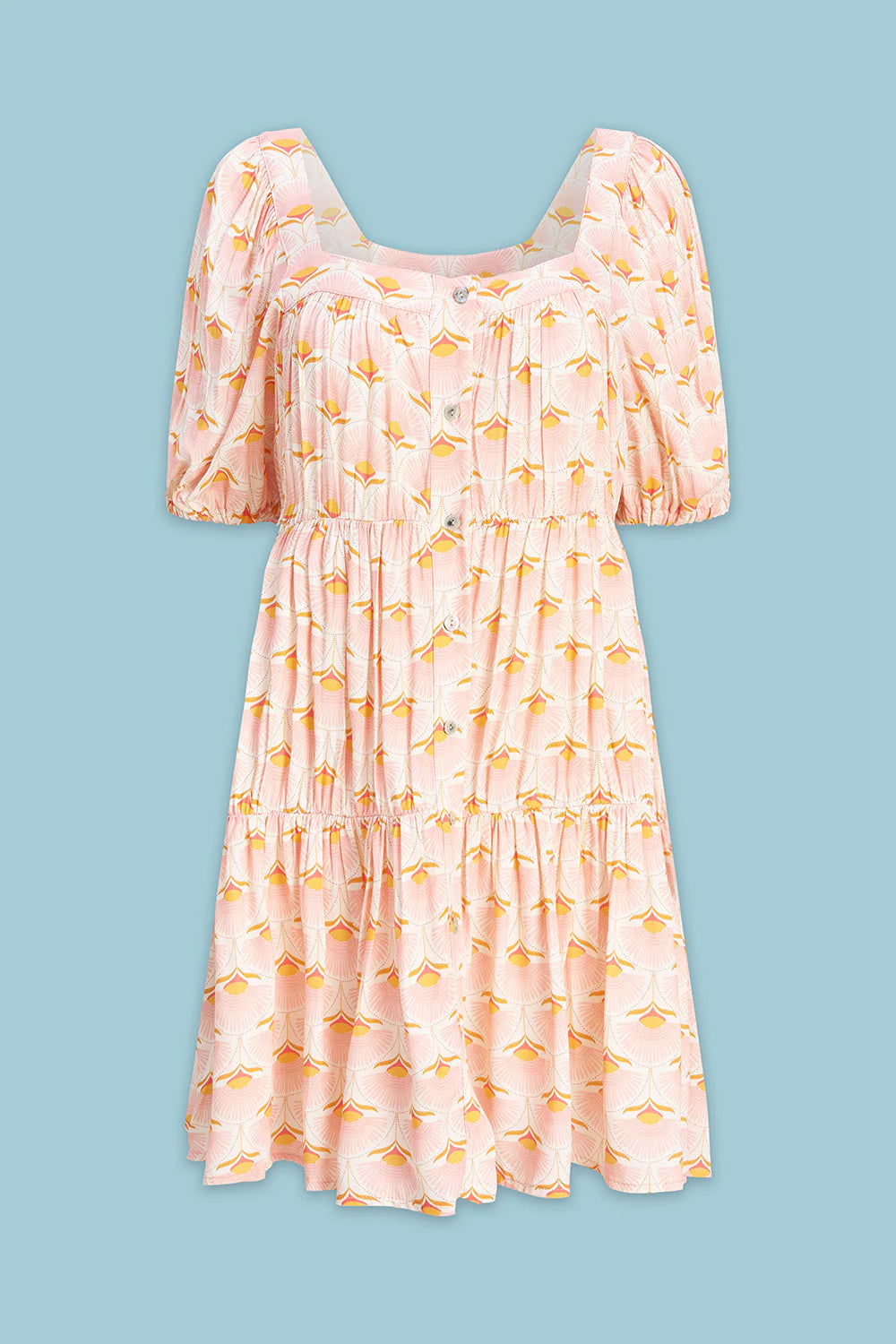 Pink dress with yellow floral pattern on a blue background
