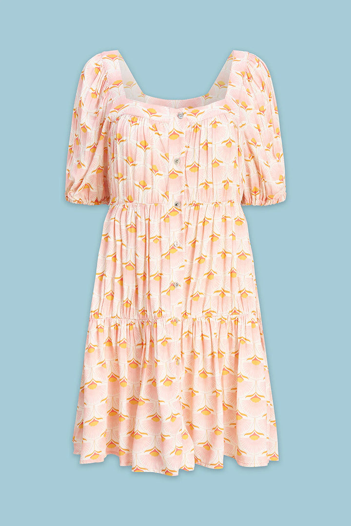 Pink dress with yellow floral pattern on a blue background