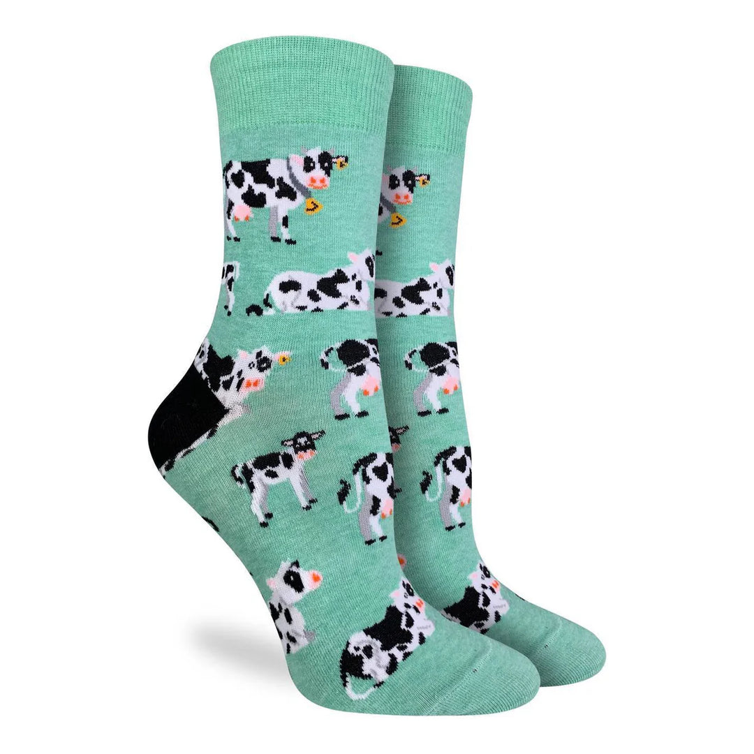 Teal socks with cow pattern on a white background