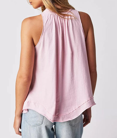 Pleated TThis high-necked Pleated Tank in Pink Lemon is both effortless and essential. Wear it with your laidback look, or layer it up to build an outfit. Its relaxed, slouchy fit features pleating at the bust and dropped armholes, while subtle distressing at the hems complete the timeless, lived-in look. Embrace effortless style with this versatile and cool classic tank.   Hand Wash Cold  Measurements for size small Bust: 41 in Length: 28 in  Contents 100% Cottonank // Pink Lemon 