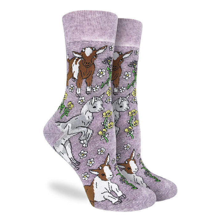 Pair of socks with goat illustrations on a light purple background