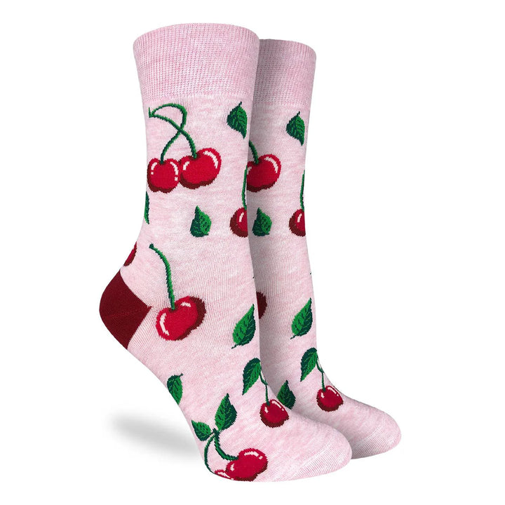 Pink socks with cherry design on a white background