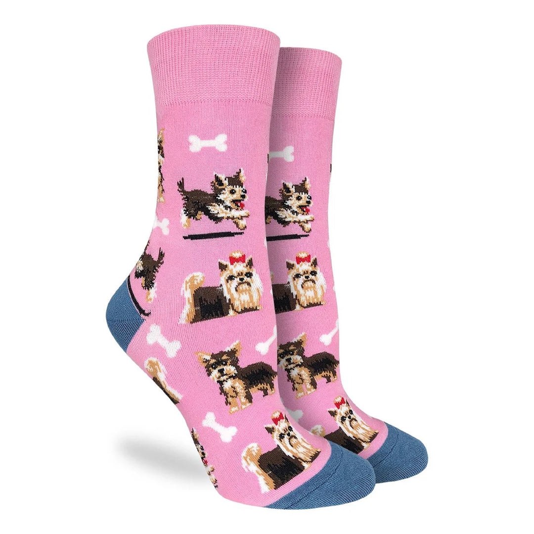 Pink socks with dog illustrations on a white background