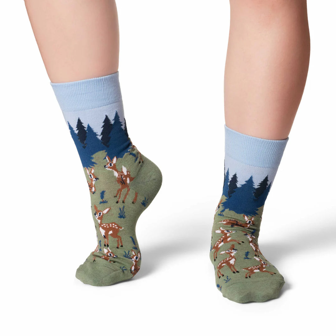 Socks with deer and forest design on a white background