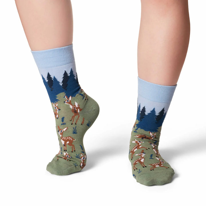 Socks with deer and forest design on a white background