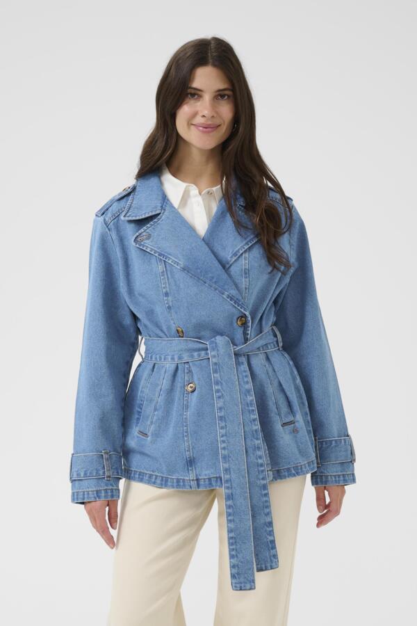 Woman wearing a blue denim jacket on a white background
