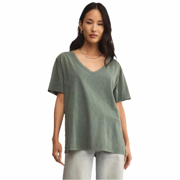 Woman wearing a green t-shirt on a white background