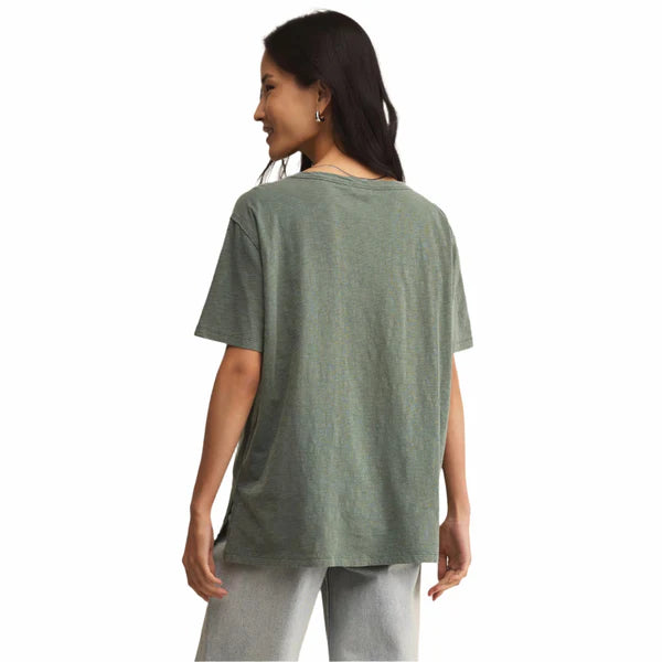Woman wearing a green t-shirt on a white background
