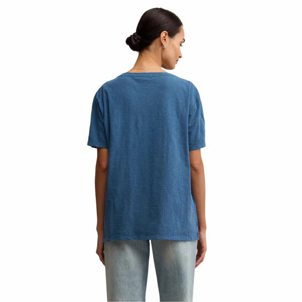 Person wearing a blue t-shirt on a white background