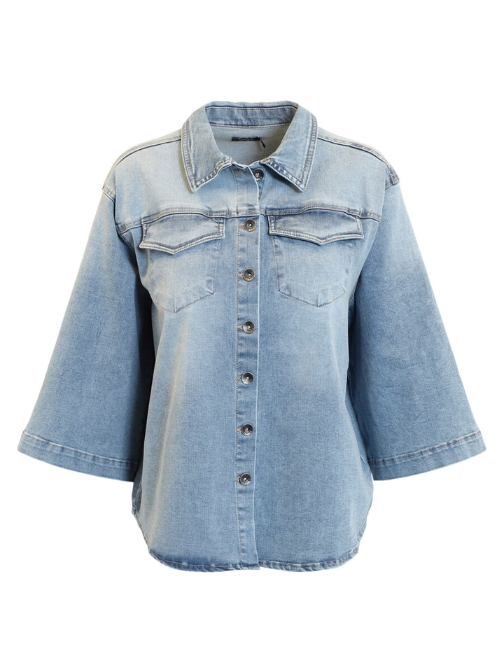 Light blue denim jacket on a white background