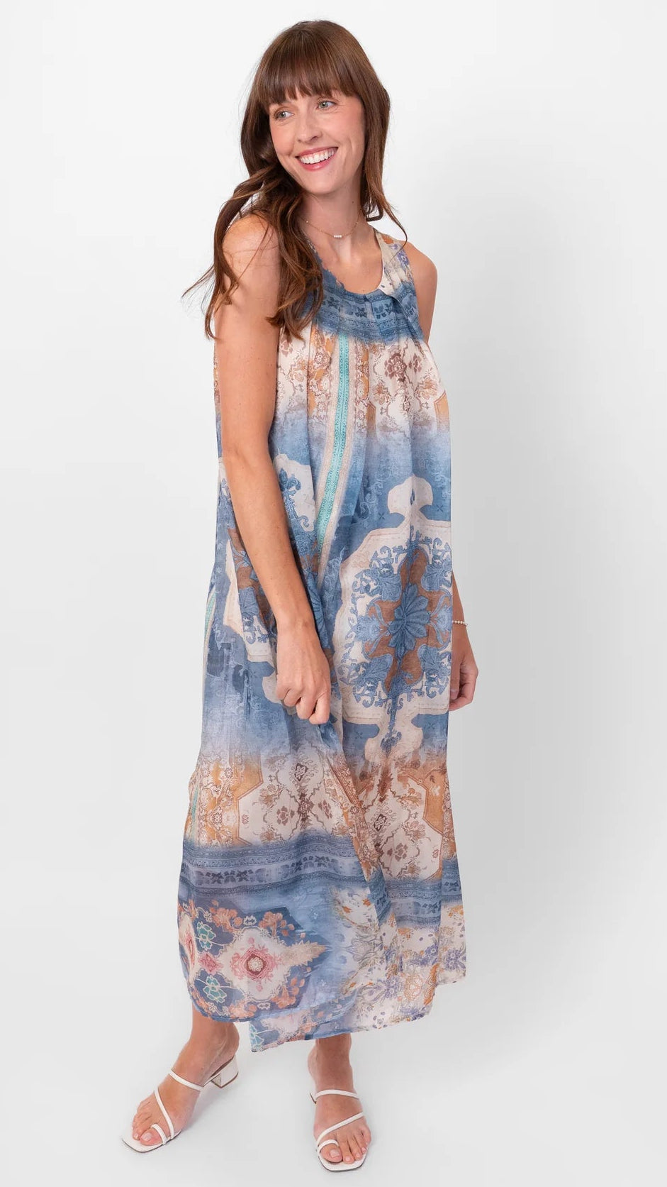 Woman wearing a floral dress on a white background