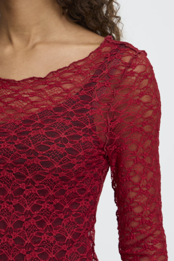 Red lace long-sleeve top on a white background