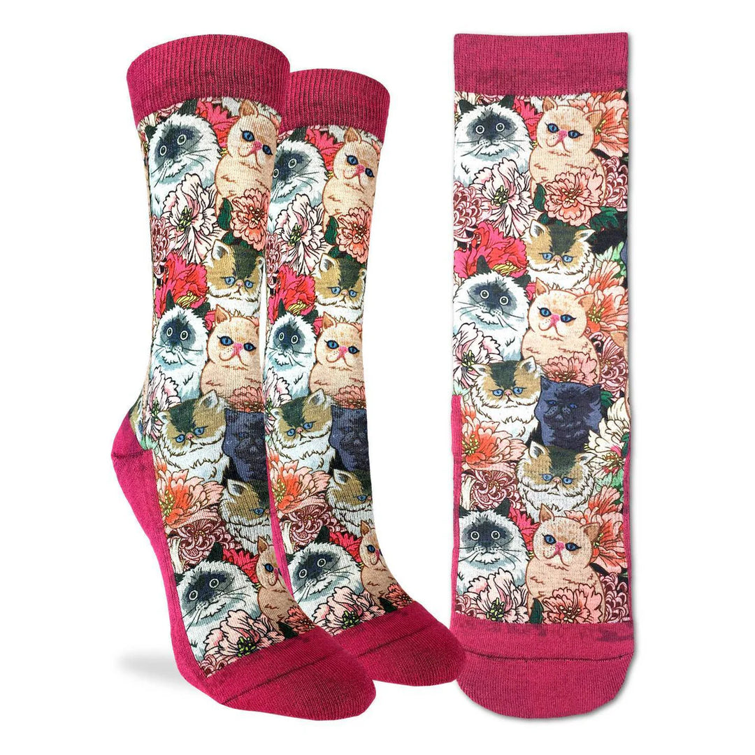 Colorful socks with cat and floral pattern on a white background
