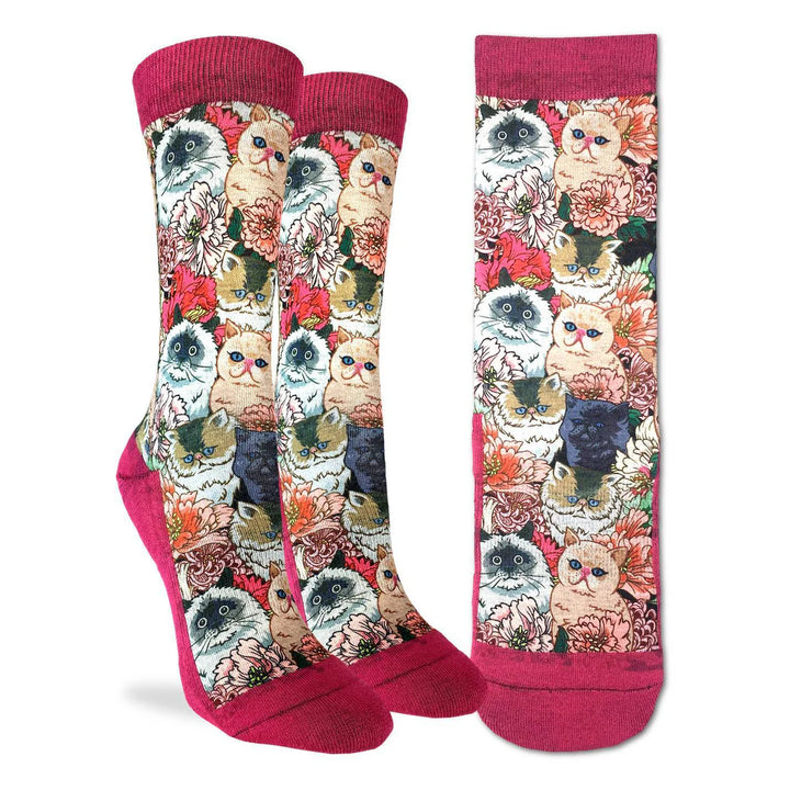 Colorful socks with cat and floral pattern on a white background