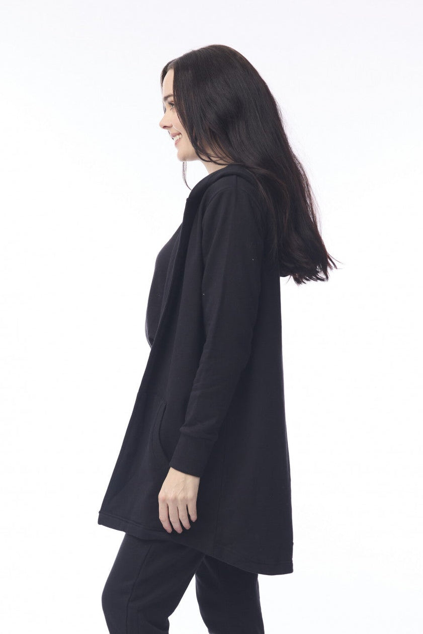 Person wearing a black outfit with white shoes on a white background