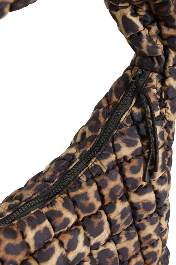 Leopard print bag with a black zipper on a white background