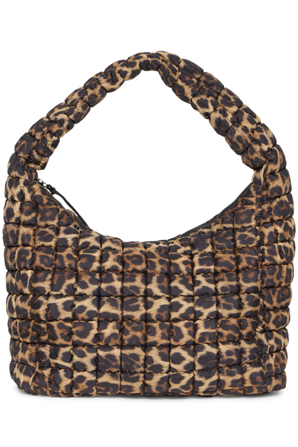 Leopard print handbag with quilted texture on a white background