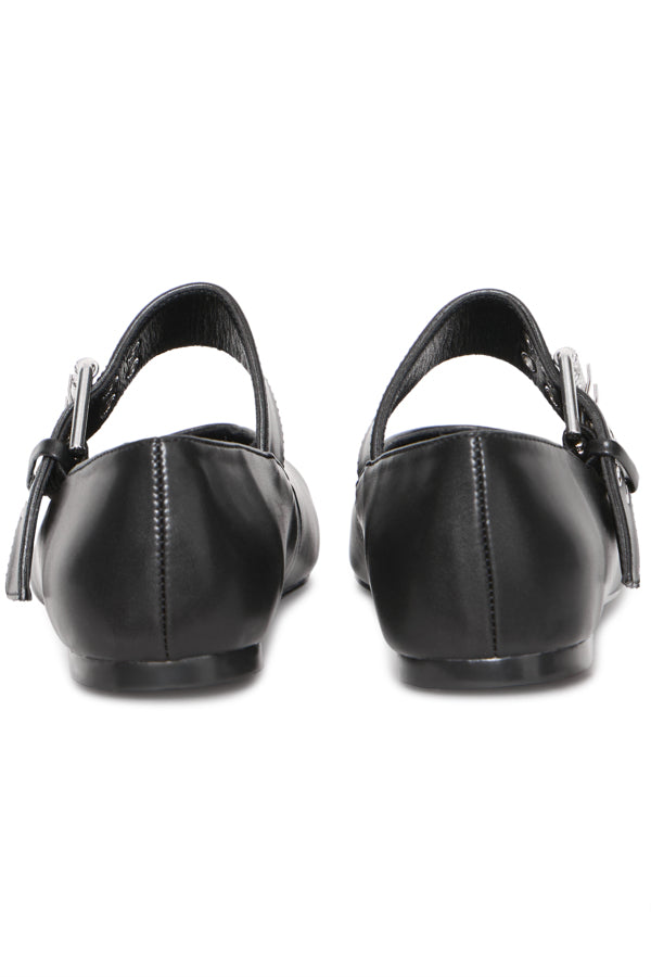 Black leather shoes with buckles on a white background