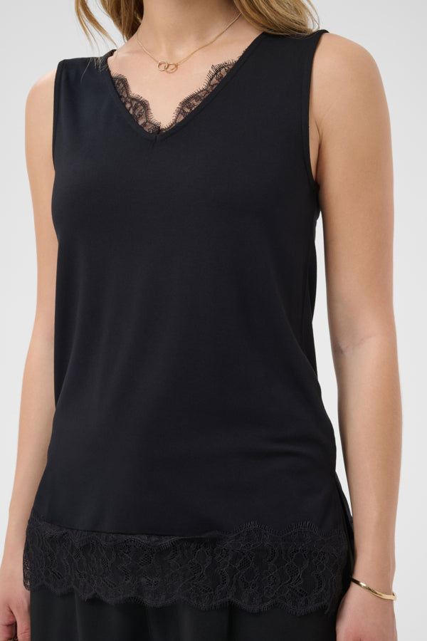 A sleeveless black V-neck top with black lace trim along the neckline and hem, shown on a model against a light gray background.