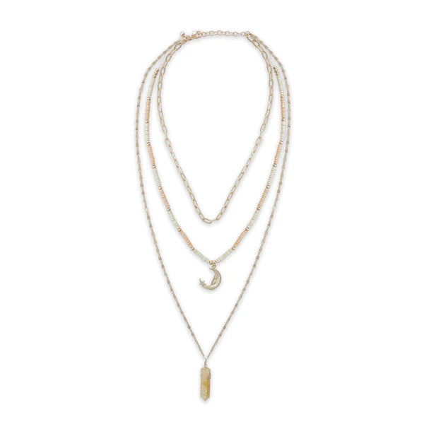 Set of three layered necklaces on a white background