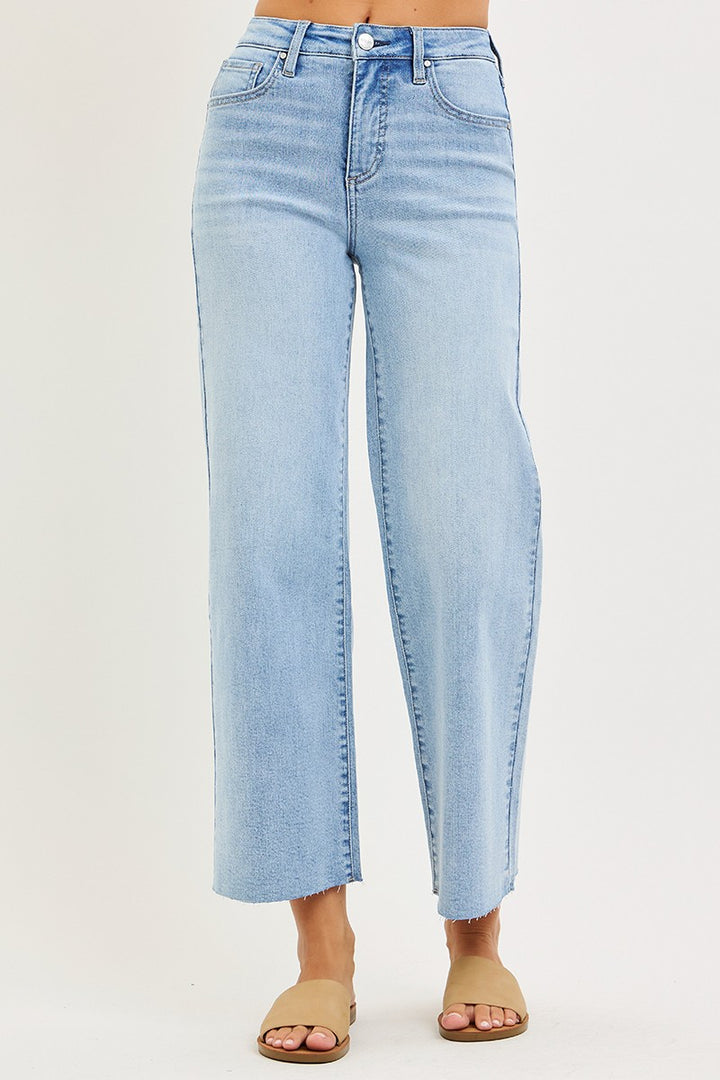 Light blue jeans on a plain background