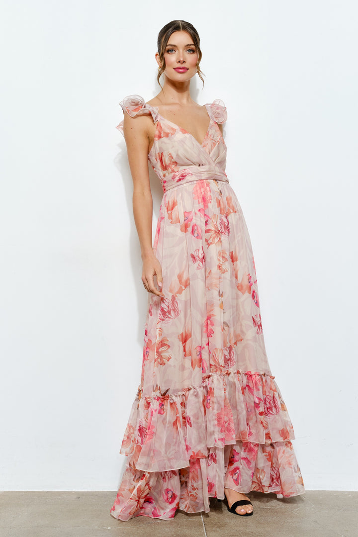 Woman wearing a floral dress against a white background